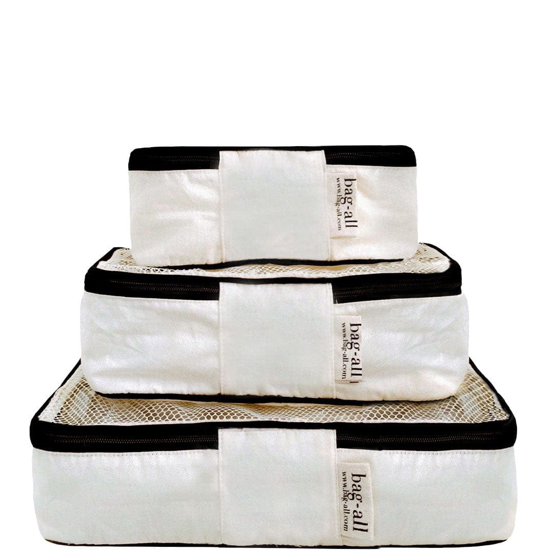 Bag-all Cotton Packing Cubes in cream with black trim, set of 3 sizes - mesh-top organizers for travel storage and closet organization, featuring durable construction and labeled design